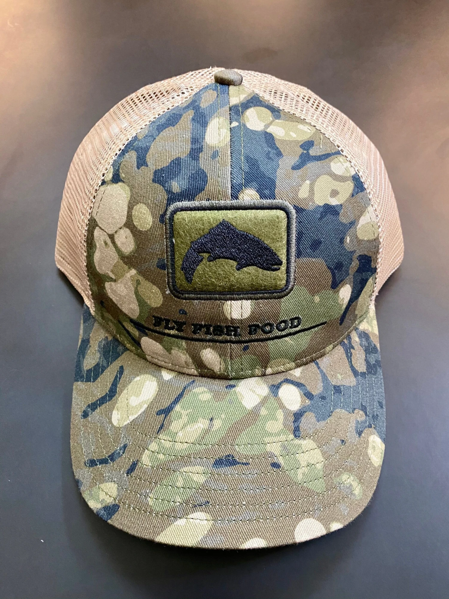 Simms - CBP Trout Icon Trucker - Riparian Camo - Fly Fish Food Logo 1 Simms - CBP Trout Icon Trucker - Riparian Camo - Fly Fish Food Logo